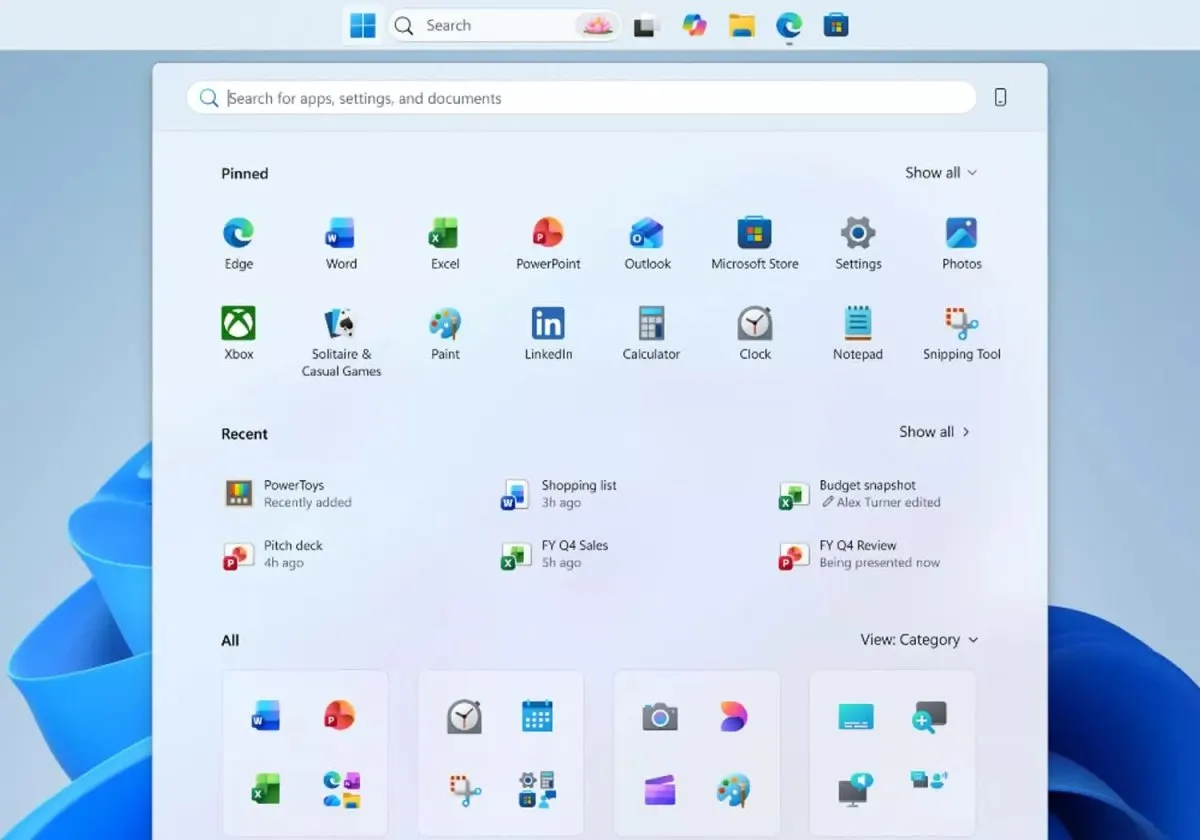 Windows 11 desktop showing the newly movable taskbar and system performance settings