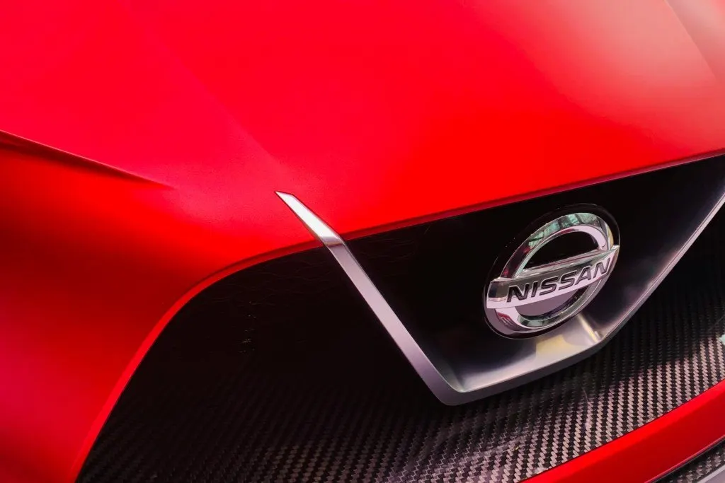 Nissan and Dongfeng executives sign a joint venture agreement for a new import export company in Guangzhou.
