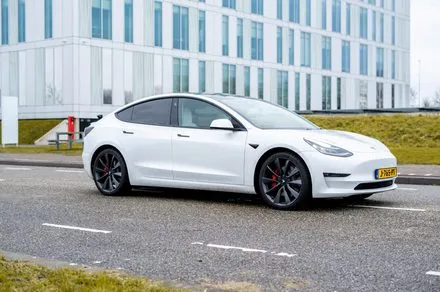A Tesla dashboard displays real time sensor data and navigation maps during an autonomous driving test.