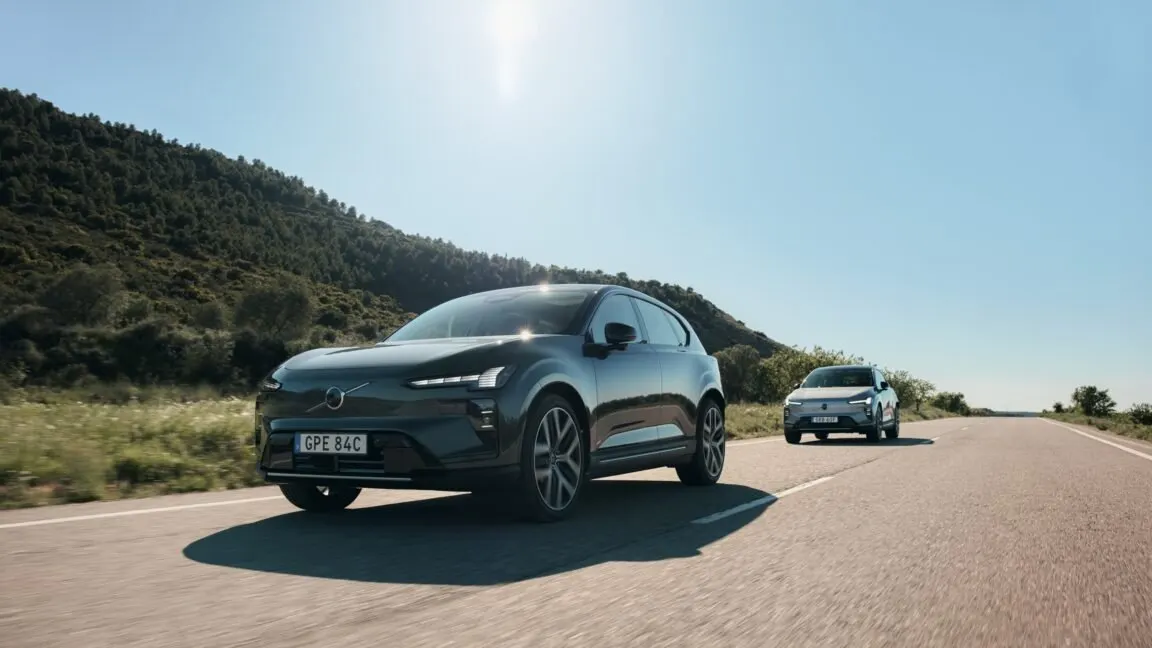 The Volvo EX60 electric crossover is shown from the front, displaying its exterior design and SPA3 platform features.