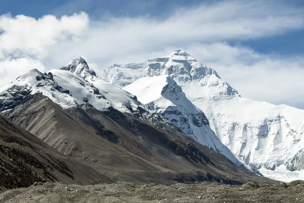 American climber Tyler Andrews summits Mount Everest in nine hours and fifty-five minutes, breaking the speed record.