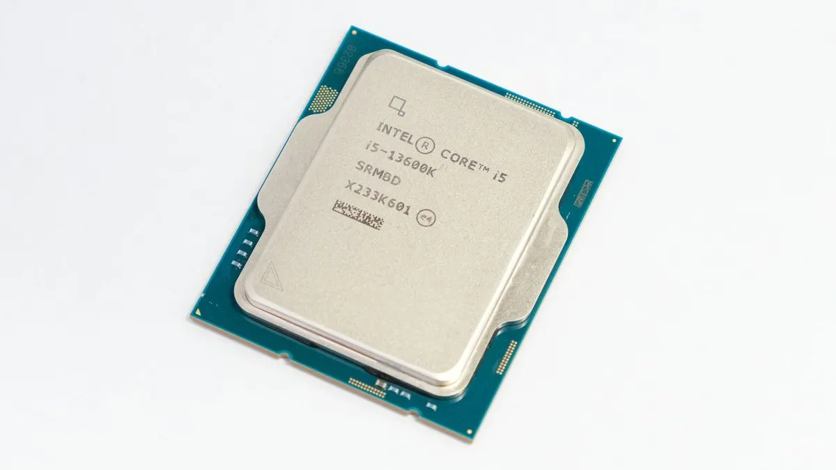 Intel Core i5-13600K processor installed on a motherboard with visible thermal solution and circuitry.