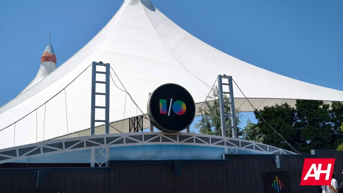 A conference stage displays Google I/O 2026 platform updates and developer roadmap.