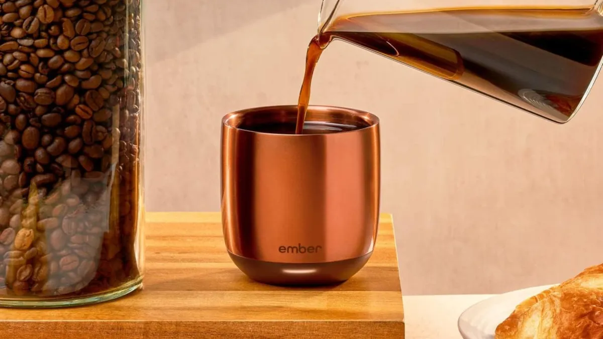 Ember Temperature Control Smart Cup resting on its magnetic charging base