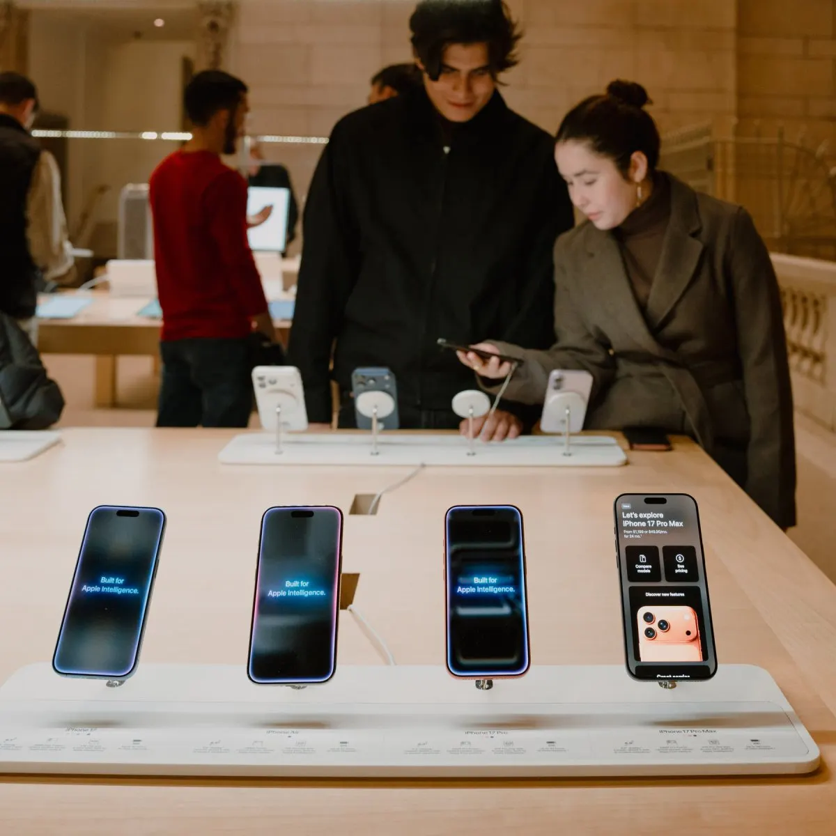 Apple devices displaying the ChatGPT interface alongside OpenAI branding