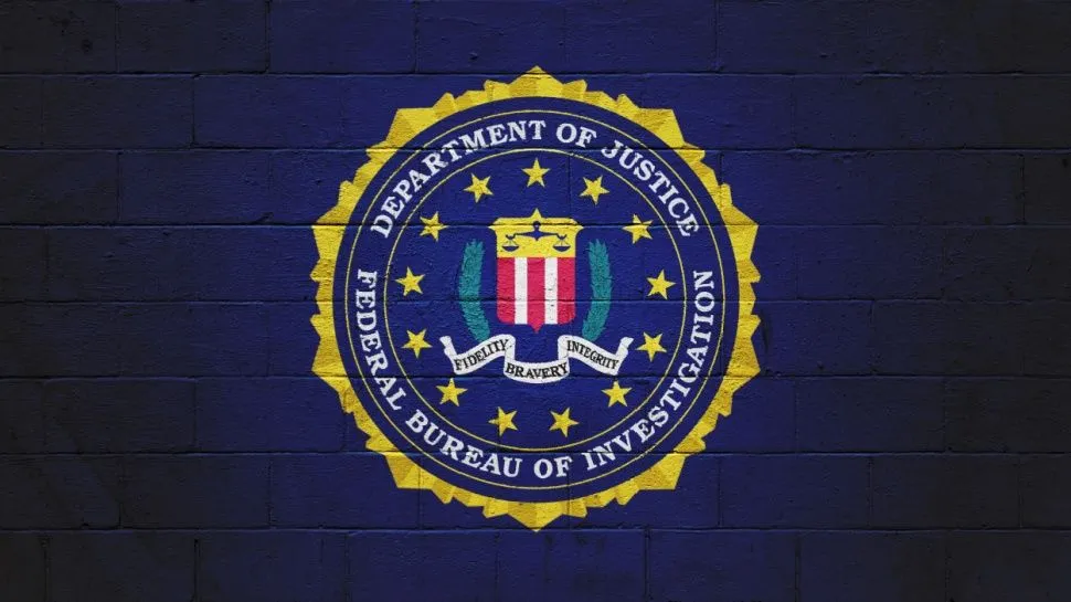 Digital forensics experts examine seized server hardware during a cyber investigation