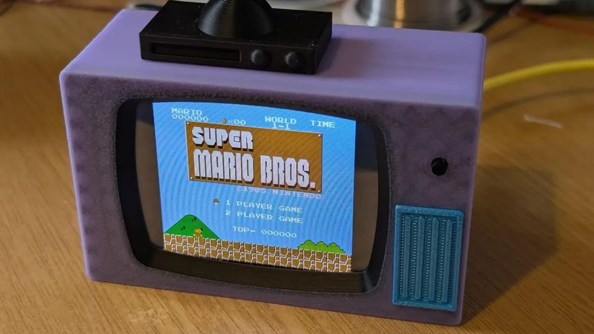 This palm-sized retro television features an ESP32 microcontroller and color display for gaming and video playback.