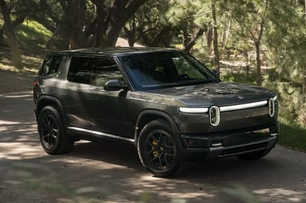 The Rivian R2 electric SUV is shown at a delivery center.