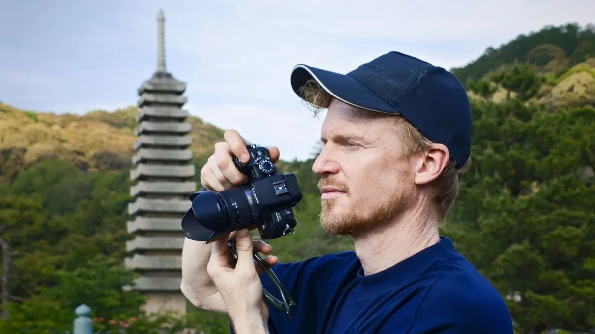 The Panasonic Lumix G1 mirrorless camera is shown with its lens attached.