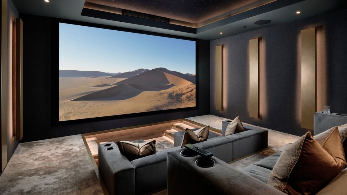 Custom home theater featuring a 9.4.4 Dolby Atmos speaker layout designed for sports viewing.