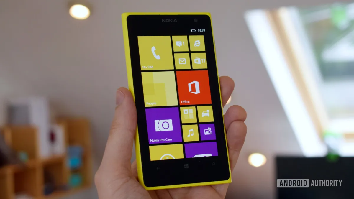 The screenshot displays the Windows Phone interface with its distinctive tile layout and system integration.