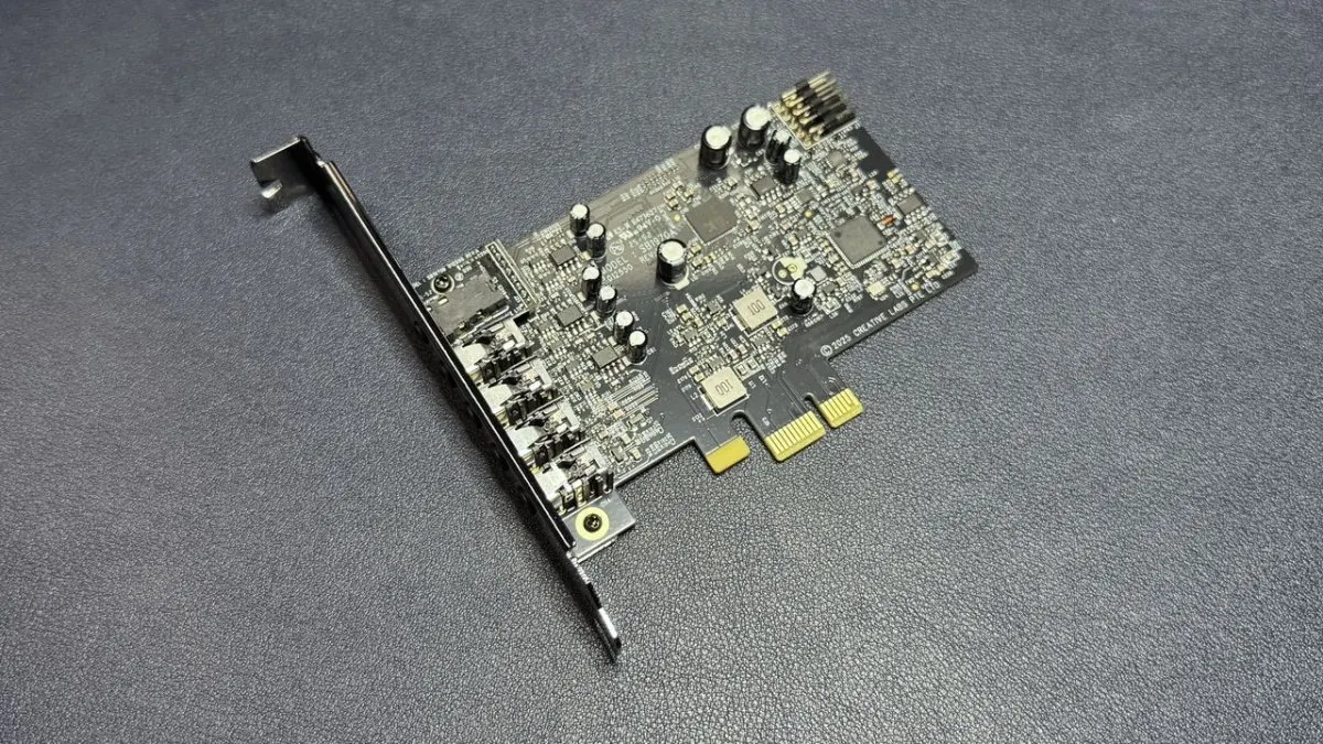 The Creative Sound Blaster Audigy FX Pro sound card displays rear audio ports and internal circuitry.