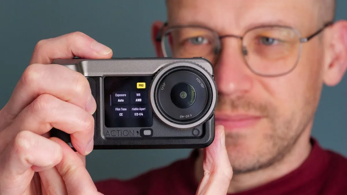 A DJI Osmo Action 6 camera mounted in a SmallRig street photography cage with ergonomic controls and a compact profile.