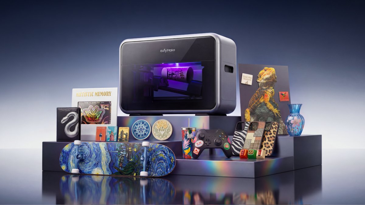 eufyMake E1 UV printer with basic and deluxe bundle accessories displayed on a work surface