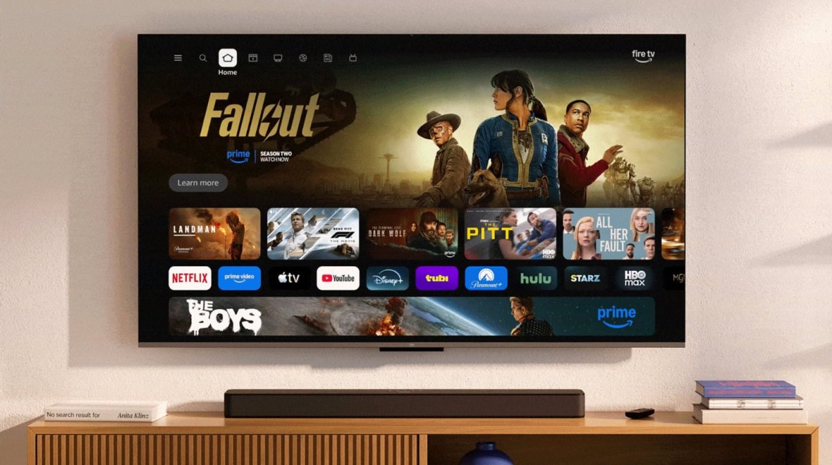 Amazon Fire TV startup screen displaying a full-screen ad prompting users to download the mobile companion app.