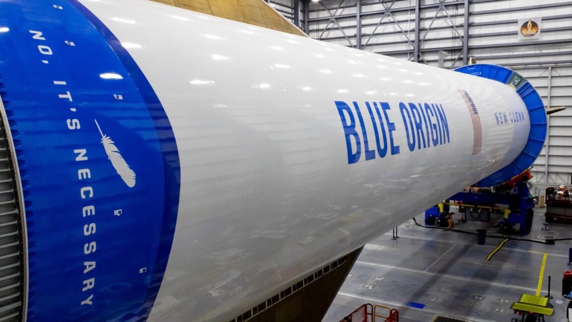 The Blue Origin New Glenn rocket stands ready for Amazon broadband satellite deployment.