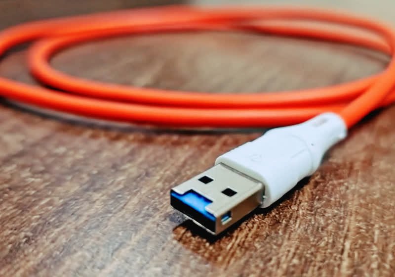 A standard USB cable connector reveals a hidden Wi-Fi microcontroller inside.