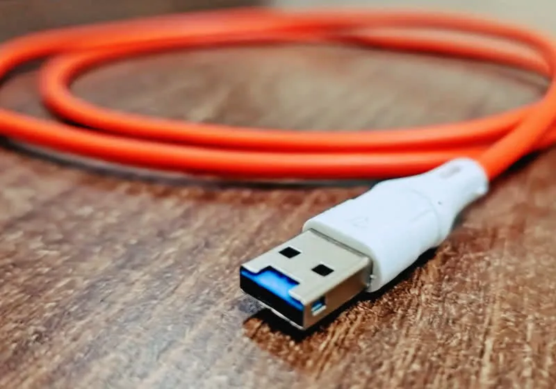 A standard USB cable connector reveals a hidden Wi-Fi microcontroller inside.