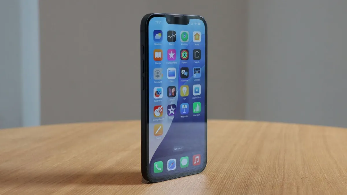 The iPhone 16e smartphone is displayed on a plain surface.