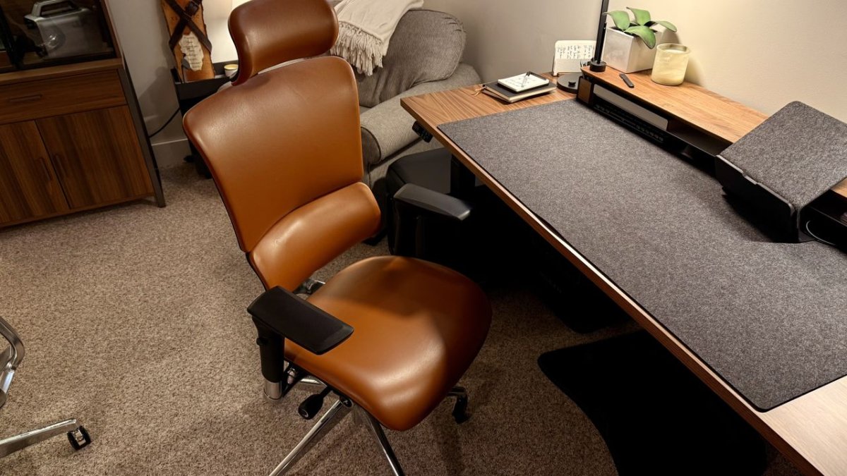 Ergonomic office chairs with temperature regulation and massage systems displayed for a Memorial Day sale.