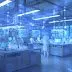 Automated laboratory setup with robotic arms conducting experiments for AI-driven scientific discovery.