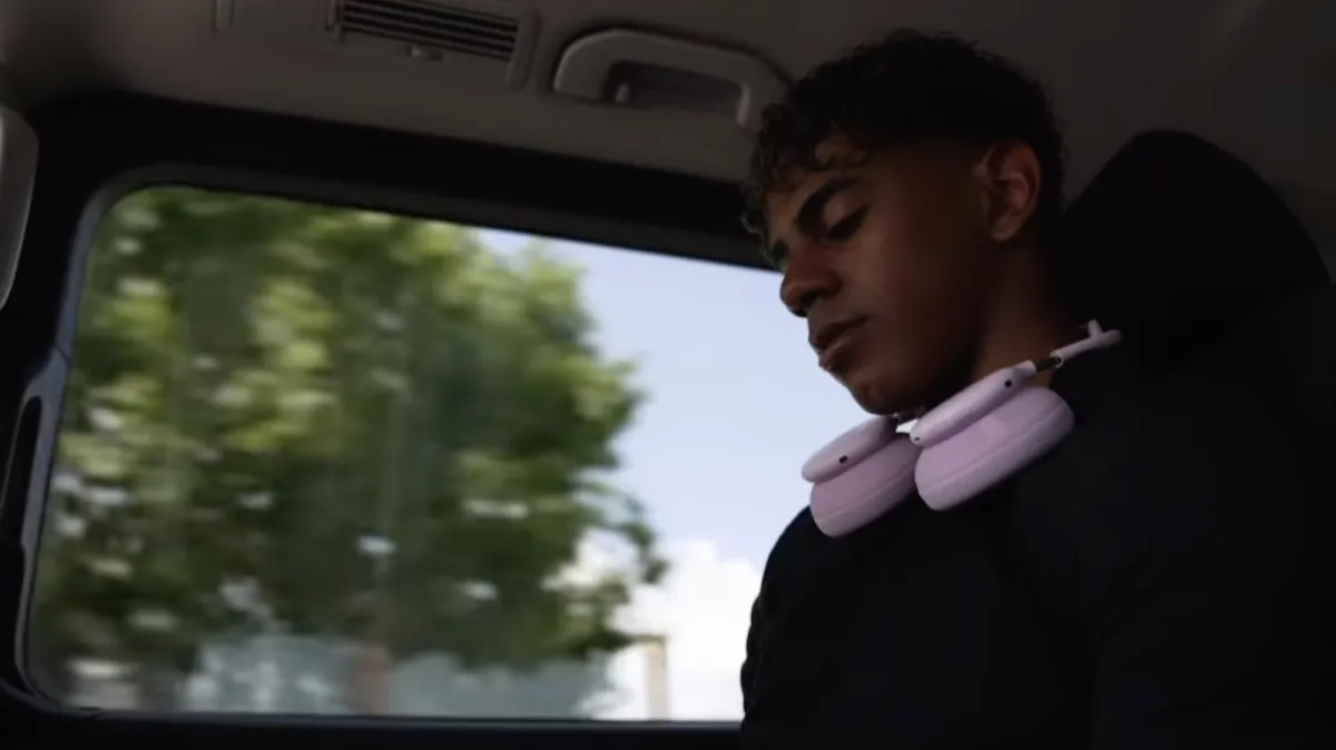 Pink headphones featuring a rounded headband design are displayed in this teaser image.