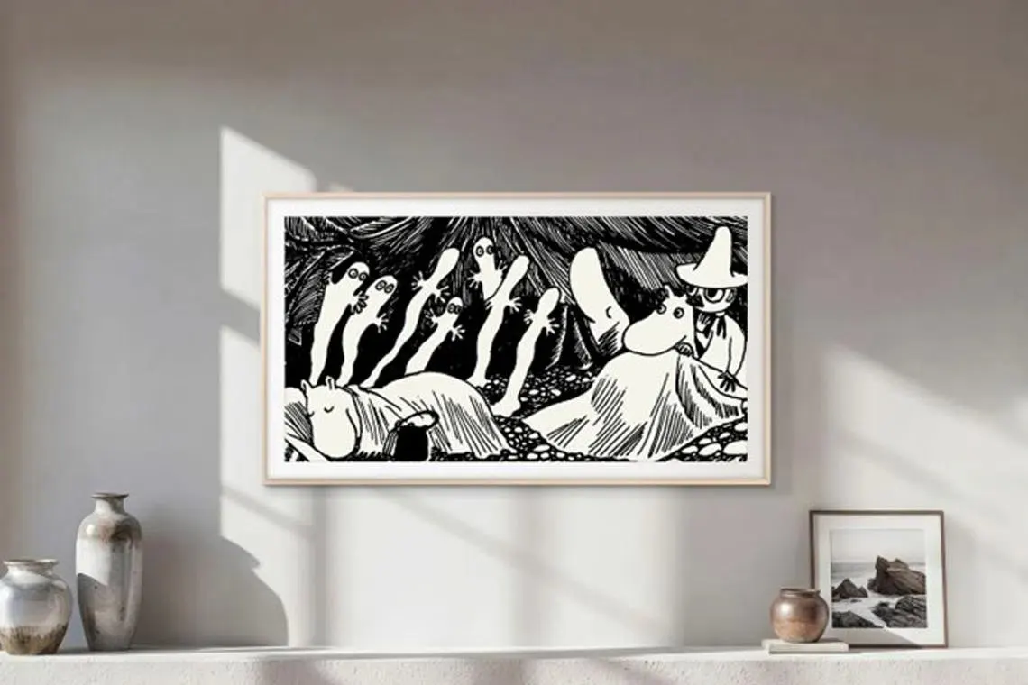 A Samsung smart television displays curated Moomin artwork illustrations.