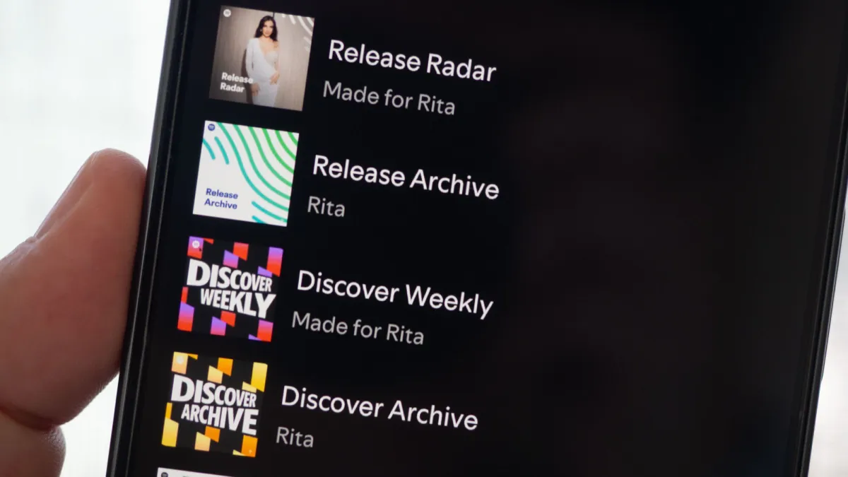 A computer screen displays a music application where a playlist cover is customized using artificial intelligence.