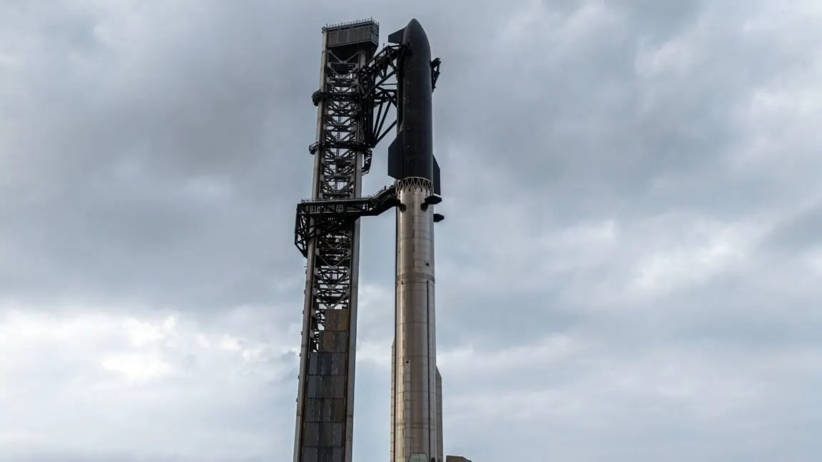 SpaceX Starship rocket stands on the launchpad during preflight preparations.