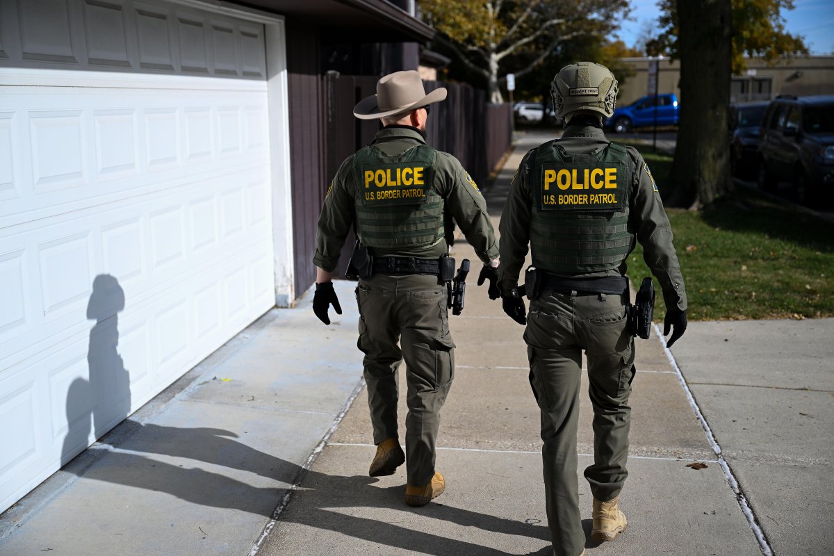 Federal agents conduct street-level apprehensions using demographic markers during mass deportation operations.