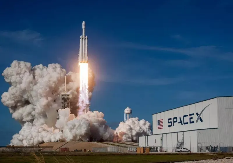 A SpaceX Falcon 9 rocket stands on the launch pad.