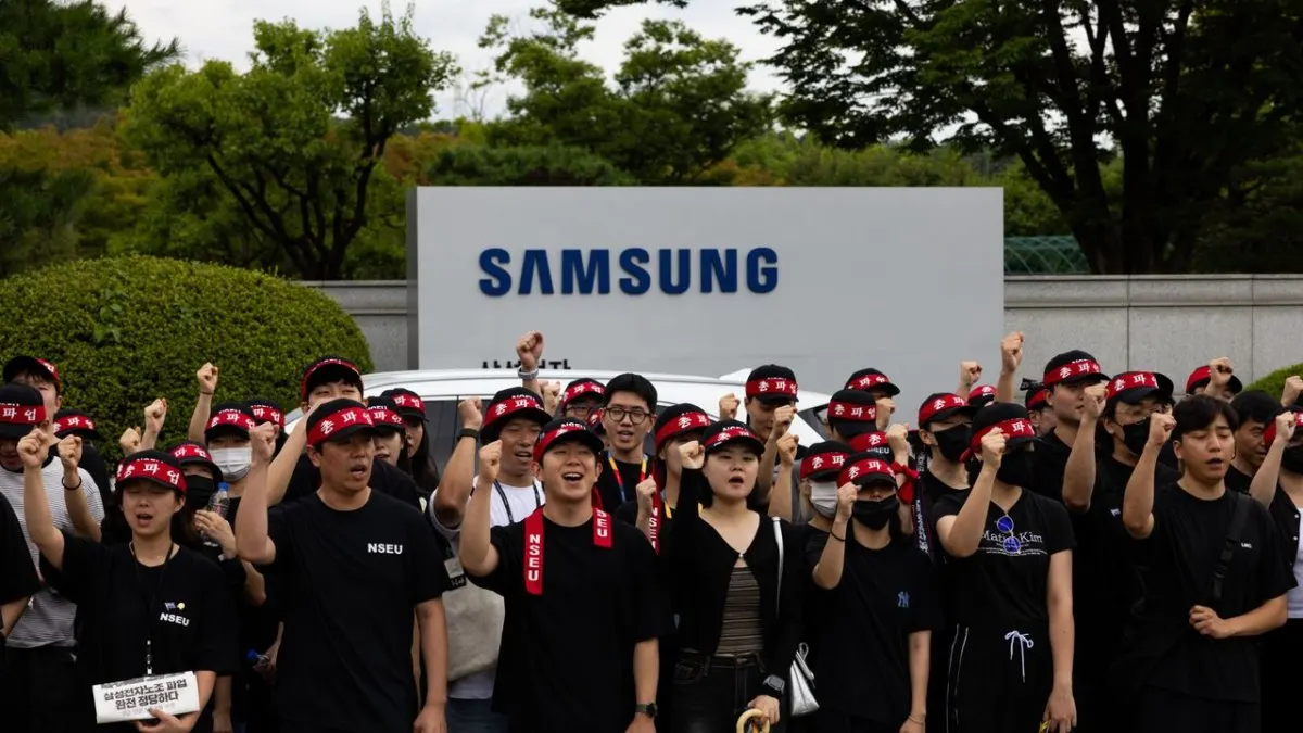 Samsung semiconductor workers and union representatives meet after reaching a tentative wage agreement.