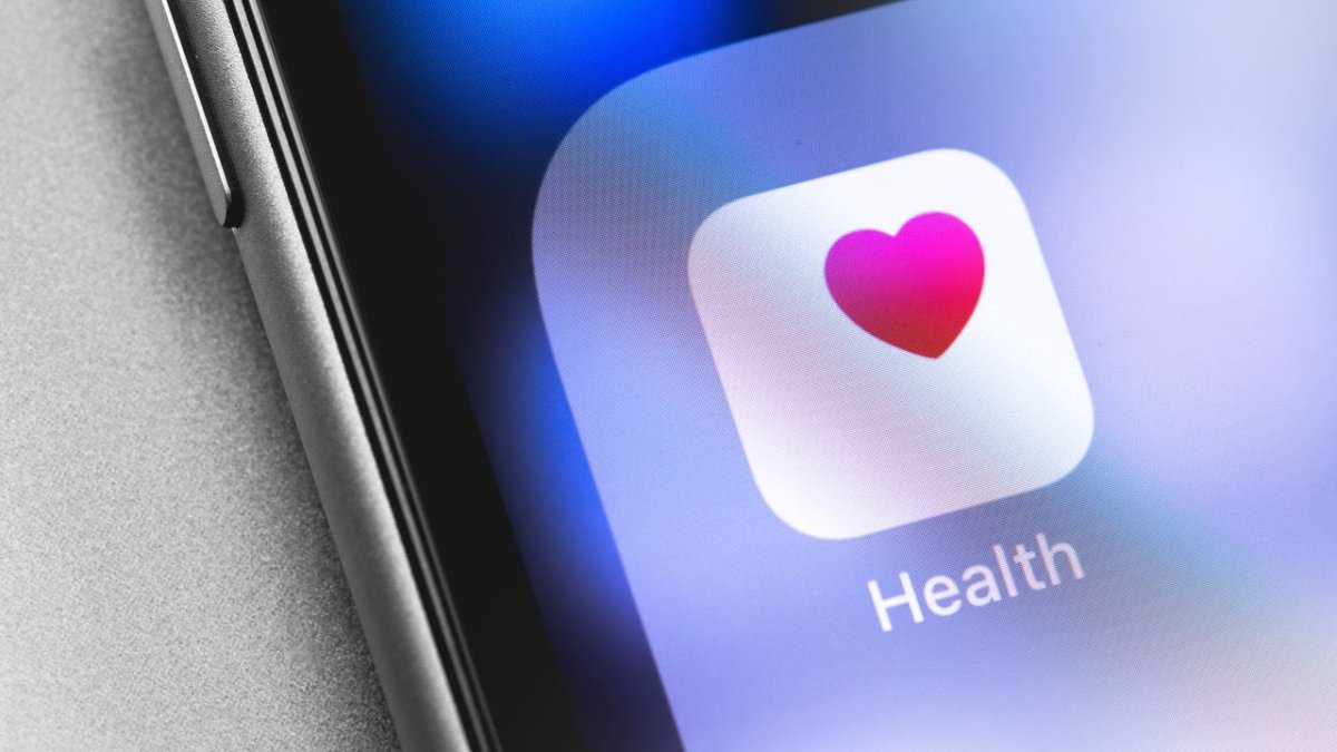 Graphic illustrating Apple's delayed AI health coach feature and biometric analysis integration
