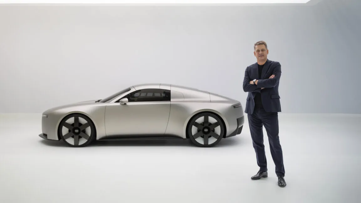 Workers assemble Audi vehicles on a production line customized for regional markets.