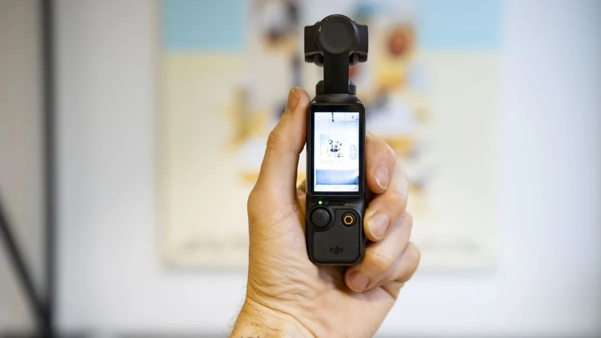 DJI Osmo Pocket 3 compact camera featuring a one-inch sensor and mechanical gimbal for stabilization.