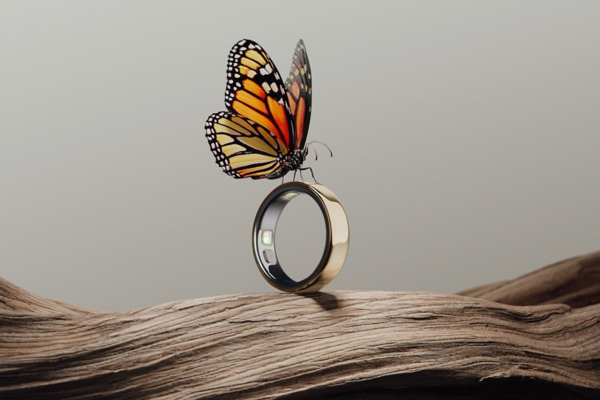 The Oura Ring 5 smart ring rests on a display stand to show its compact design and sensor layout.