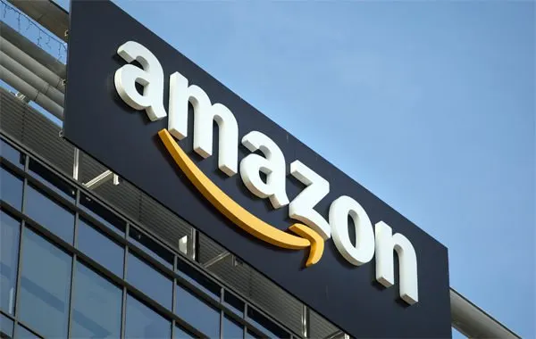 A corporate building exterior symbolizes Amazon strategic restructuring and workforce adjustments.