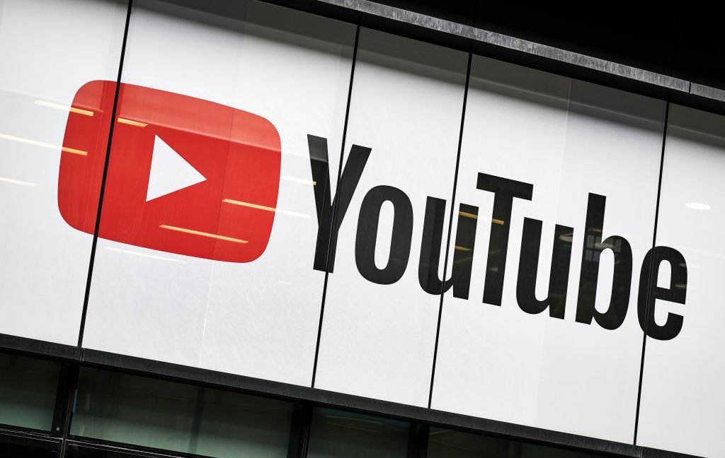 YouTube displays an automated on-screen tag to identify photorealistic synthetic videos.