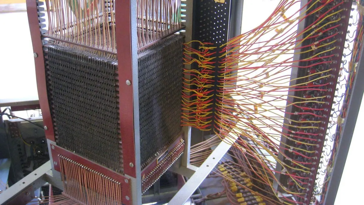Intersecting copper wires threading through tiny ferrite rings in Jay Forrester's coincident-current magnetic core memory.