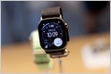 The Apple Watch displays health tracking data on its screen.