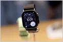 The Apple Watch displays health tracking data on its screen.