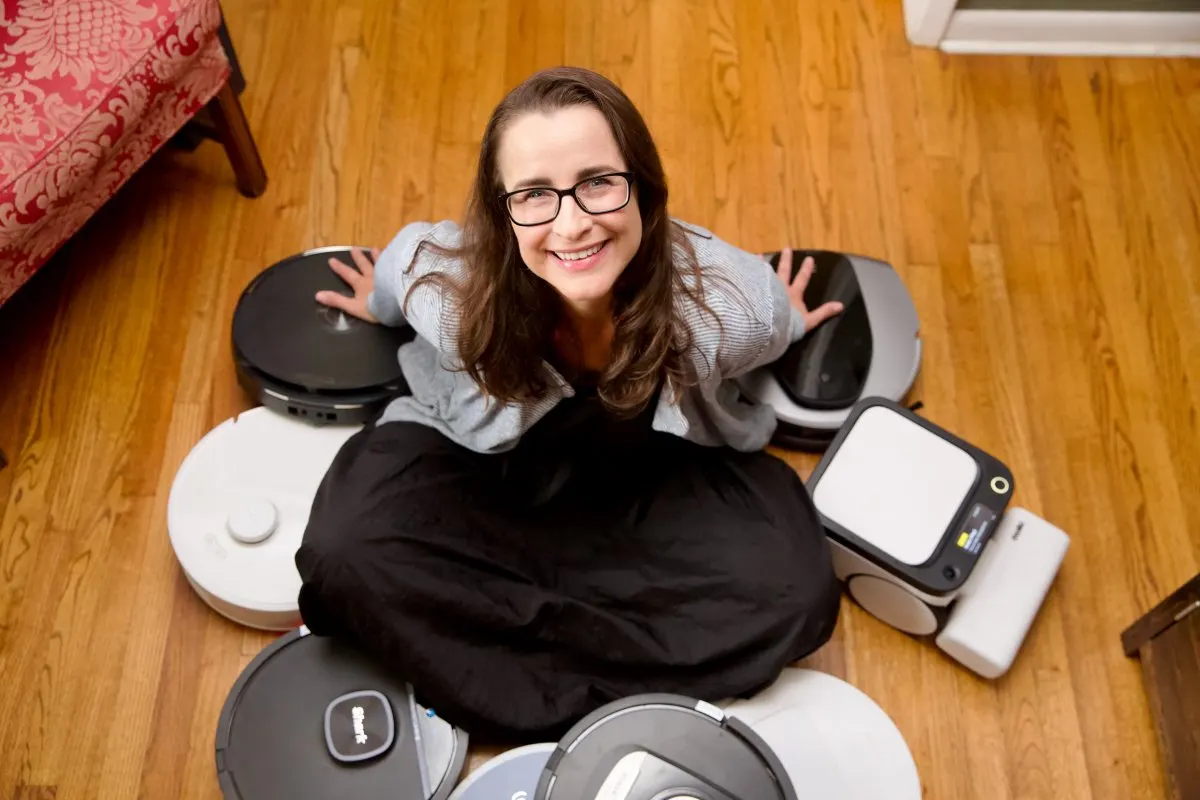 A robot vacuum maps a room layout while navigating around furniture to optimize automated cleaning paths.
