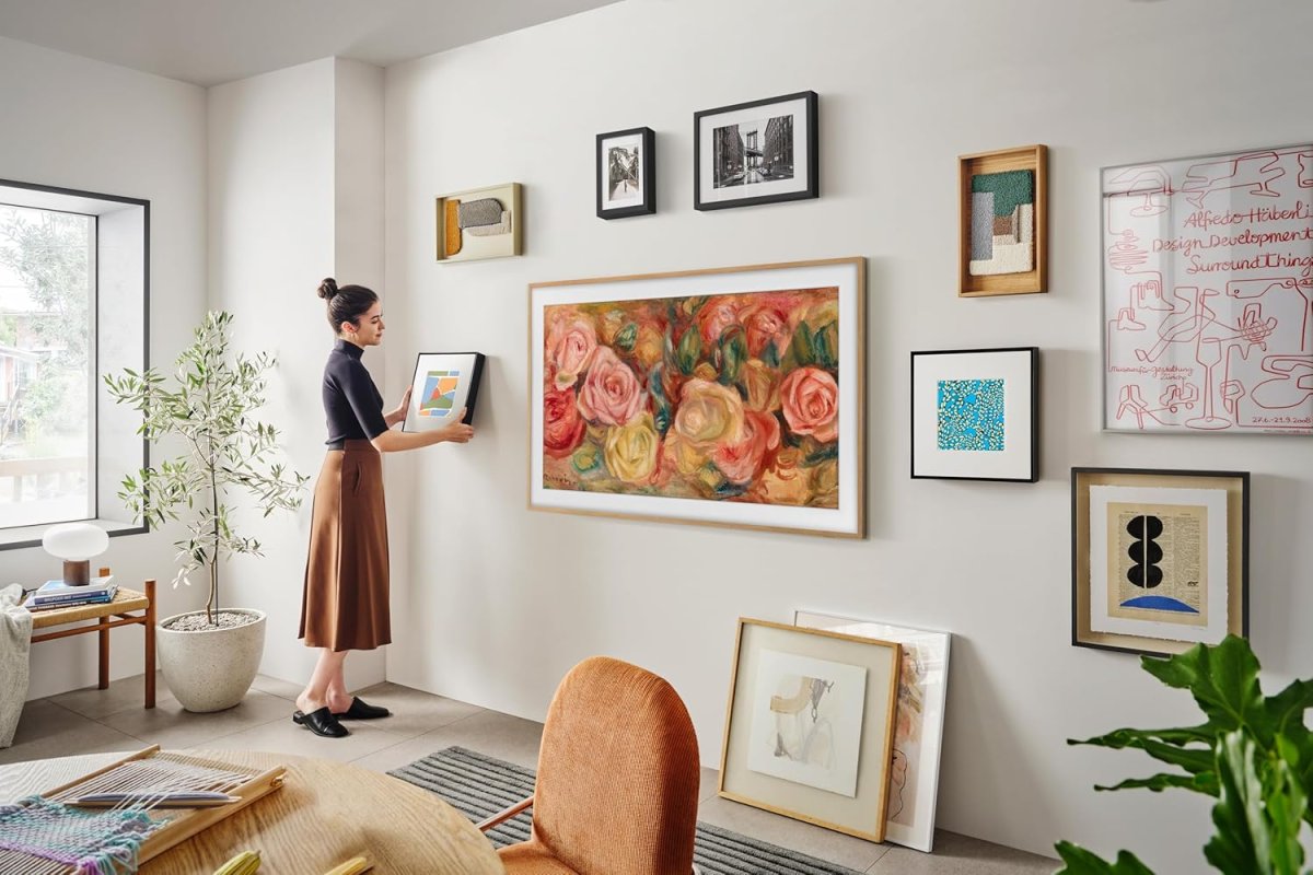 Side by side comparison of the Samsung Frame and Hisense CanvasTV smart displays with their frames attached.