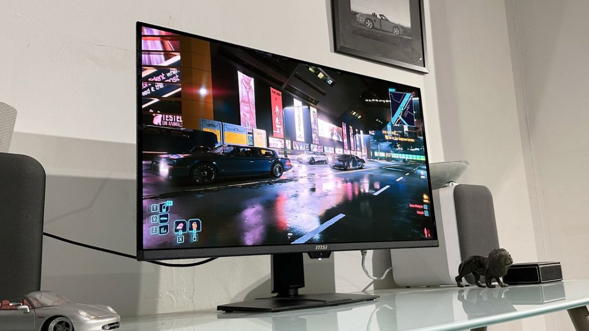 The MSI MPG 322UR QD-OLED X24 monitor displays a vibrant gaming scene with high dynamic range colors.