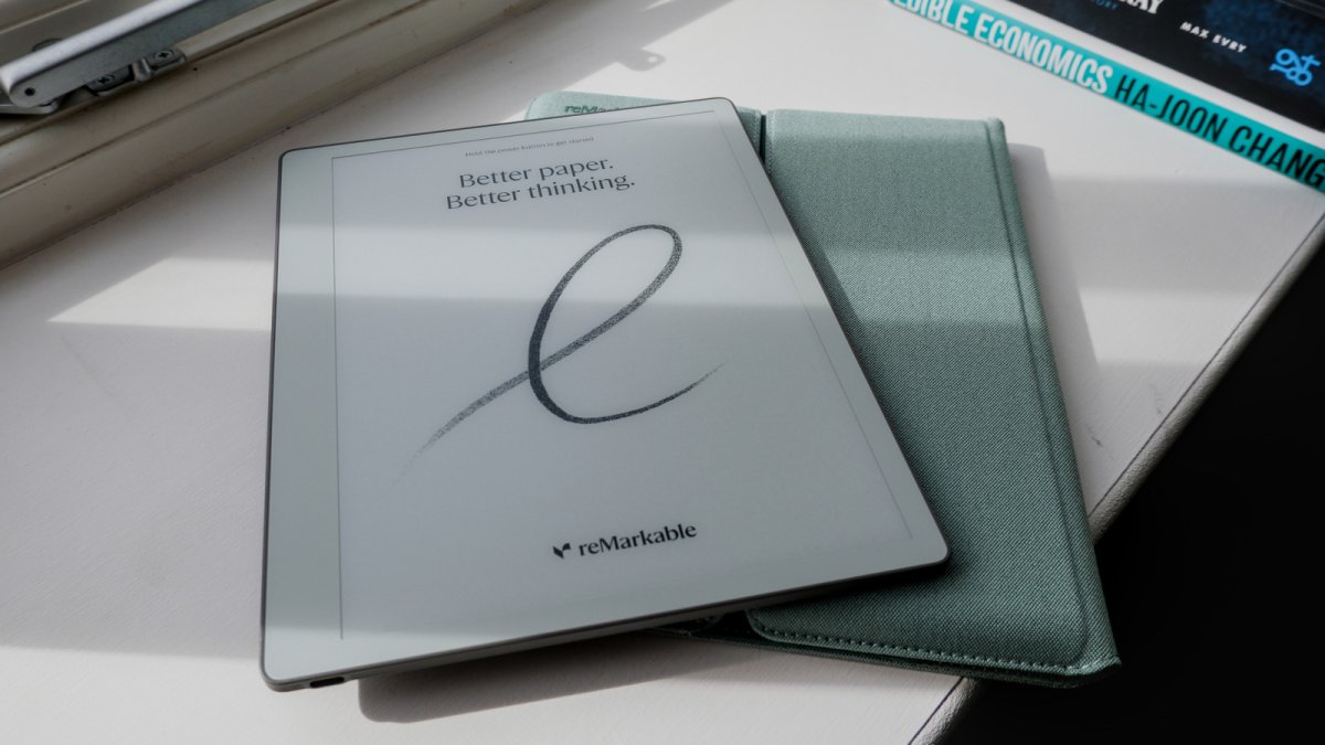 The reMarkable Paper Pure e-paper tablet rests on a desk with its stylus placed beside it.