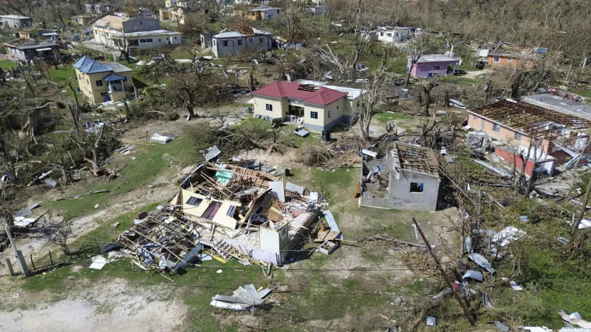 A weather map displays projected Atlantic hurricane tracks and coastal emergency preparedness zones for 2026.