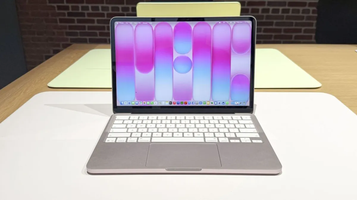 New Apple laptops are arranged on tables during a Kansas City Public Schools technology transition.