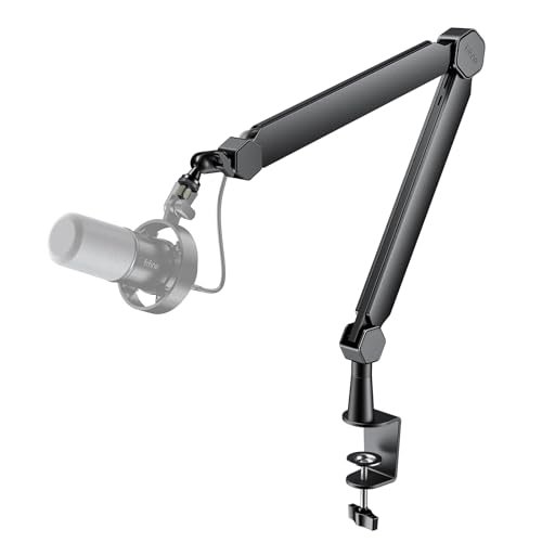 A desktop microphone arm kit is mounted on a desk, displaying adjustable joints and a professional studio microphone.
