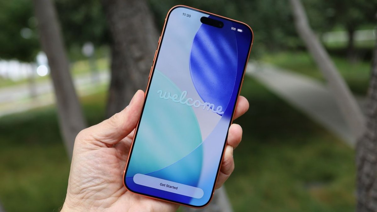Smartphones are displayed alongside carrier discount flyers and trade-in offer details.