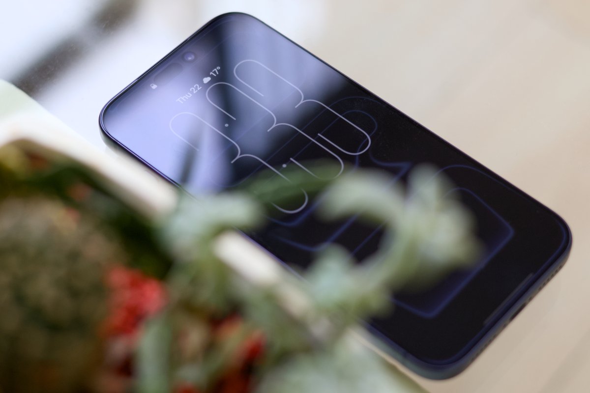 This rendering shows the expected 2027 iPhone Pro design featuring a curved display and haptic buttons.
